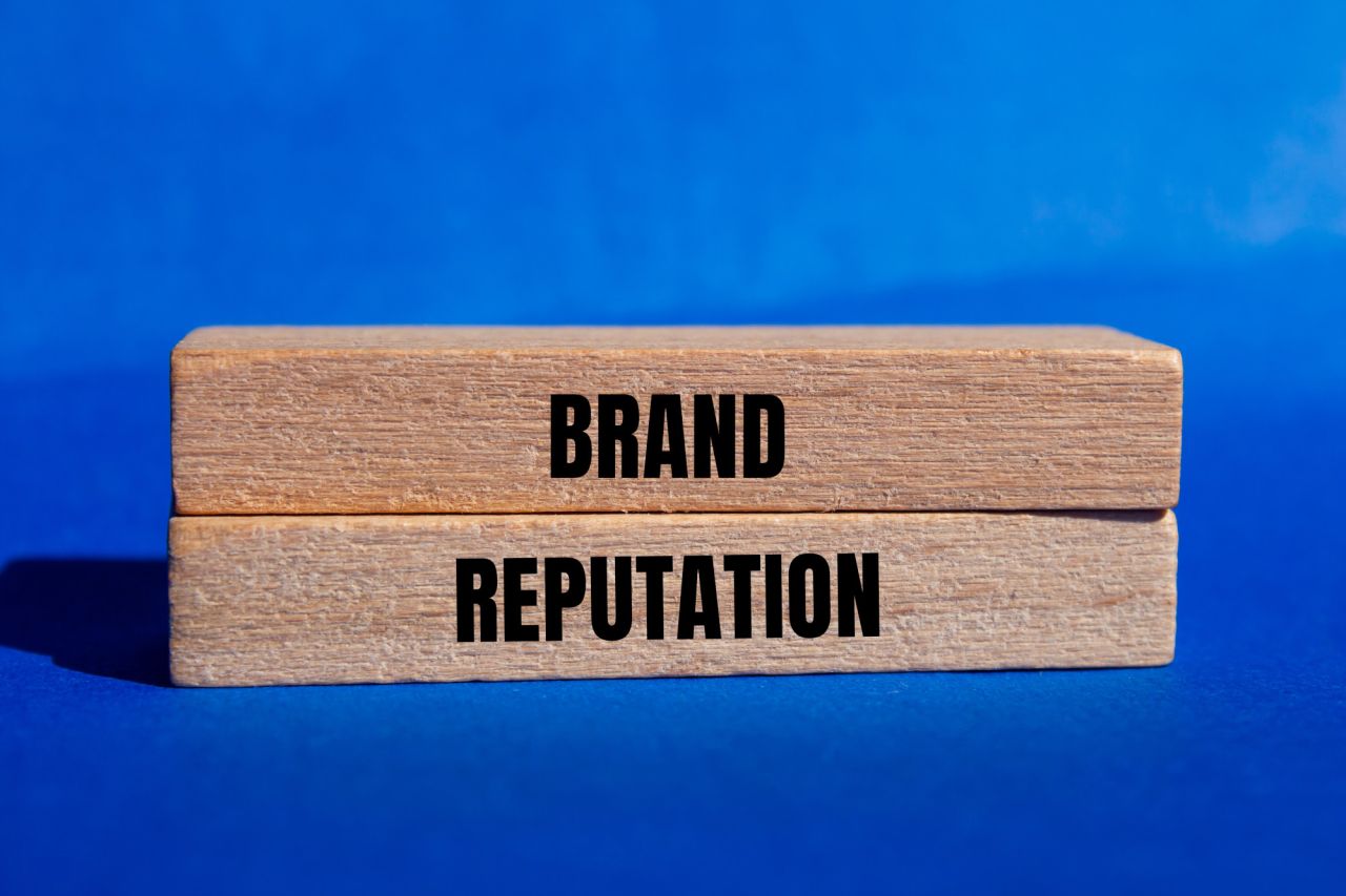 Brand reputation message written on wooden blocks with blue background Conceptual brand reputation symbol